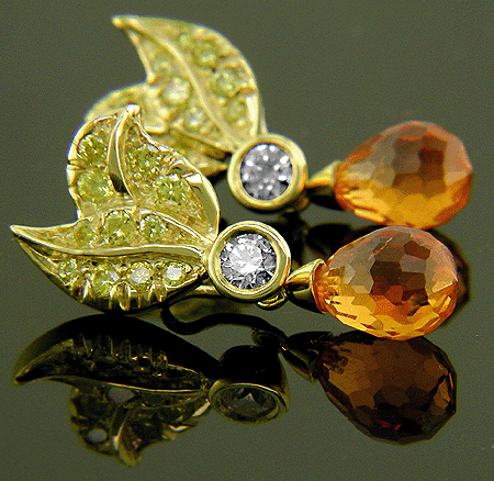 Spessartite garnets and Fancy Intense Yellow diamonds in custom earrings.