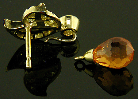 Rear view of spessartite garnet and yellow diamond earrings.
