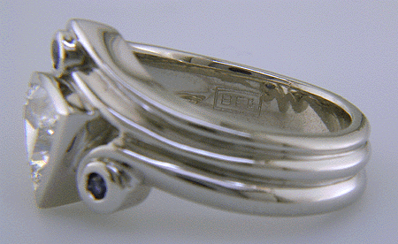 Close-up of Bijoux Extraordinaire hallmark (BEL).