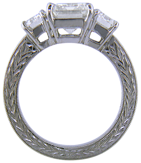 Side view three Emerald-cut Diamonds in a custom platinum ring.
