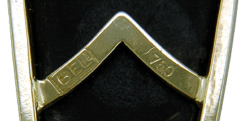 Close-up of Bijoux Extraordinaire hallmark (BEL) and precious metal marks.