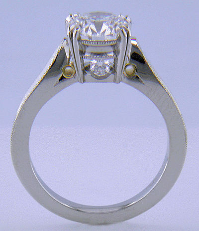 Side view of platinum diamond ring with 18kt gold accents.