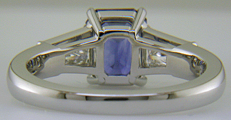 Emerald-cut Sapphire with tapered baguette diamonds in a custom platinum ring. (J8643)