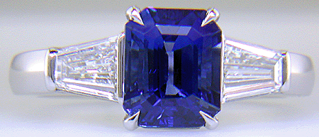 Emerald-cut Sapphire with tapered baguette diamonds in a custom platinum ring. (J8643)