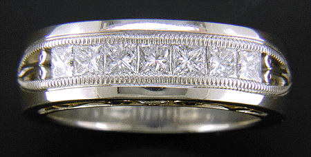 Custom wedding ring with seven princess-cut diamonds.