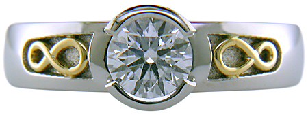 Custom platinum diamond ring with 18kt infinity symbols.