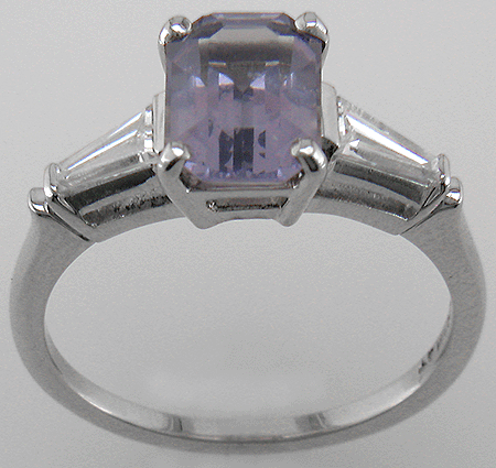 Estate platinum ring with a lavender spinel and two tapered baguette diamonds.