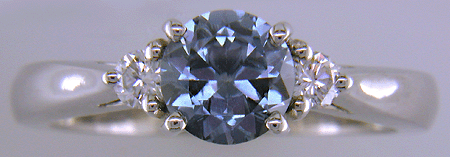 Montana Sapphire set with two round diamonds in a hand-crafted platinum ring. (J8536)
