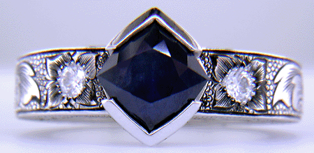 A Montana Sapphire set with diamonds in a beautifully hand-engraved platinum ring. (J7239)