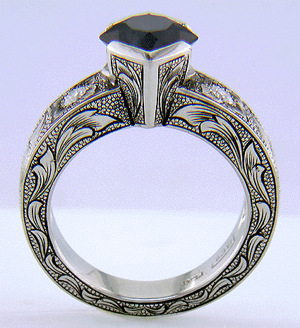 Side view of hand-engraved ring set with a Montana Sapphire and diamonds. (J7239)