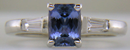 Morph-cut Sapphire with tapered baguette diamonds in a custom platinum ring. (J8545)