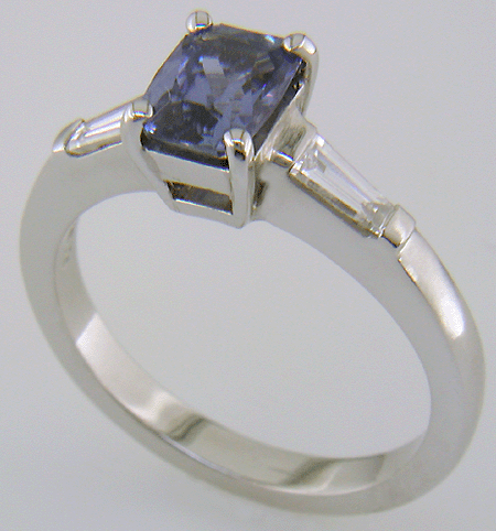 Morph-cut Sapphire with tapered baguette diamonds in a custom platinum ring. (J8545)