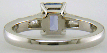 Inside view of Morph-cut Sapphire with tapered baguette diamonds in a custom platinum ring. (J8545)