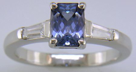 Morph-cut Sapphire with tapered baguette diamonds in a custom platinum ring. (J8545)