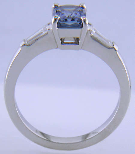 Morph-cut Sapphire with tapered baguette diamonds in a custom platinum ring. (J8545)