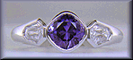 Purple sapphire set with two calf-head diamonds in a platinum ring.