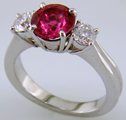 A Red spinel set with two ideal-cut diamonds in a beautiful platinum ring. (J7240)