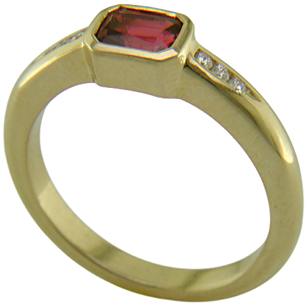Emerald-cut Red Spinel set with round brilliant-cut diamonds in a handcrafted ring. (J6776)