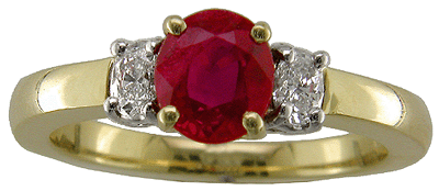 Head on view of ruby and diamond 18kt gold ring.