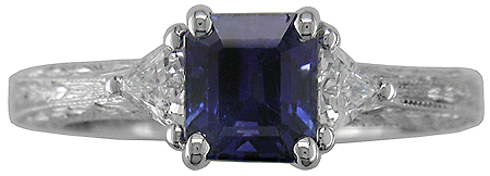 Head view of sapphire and diamond engraved ring.