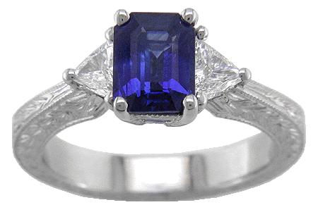 Sapphire and trilliant diamond platinum hand engraved ring.