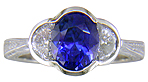 Sapphire Rings - Oval saphire set with crescent moon diamonds in an engraved platinum ring. (J7269)