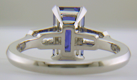 Inside view of hand-crafted platinum ring with a sriking emerald-cut Sapphire and sparkling bullet-shape diamonds. (J7418)