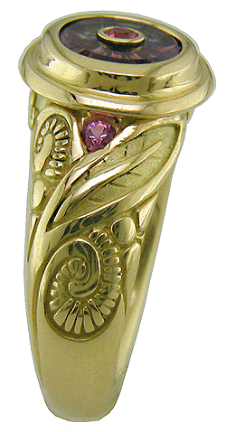 Torus-cut sapphire set in 18kt gold ring.