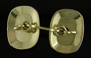 Elegantly engraved platinum and sapphire cufflinks. (J8973)