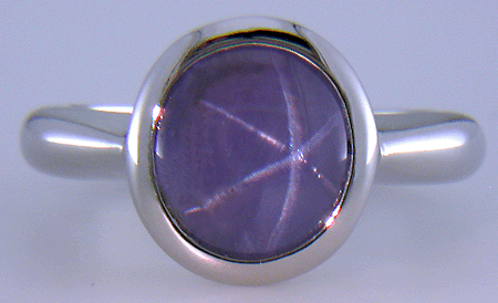 Purple star sapphire ring hand crafted in platinum.