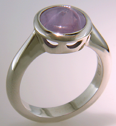 Purple star sapphire ring hand crafted in platinum.
