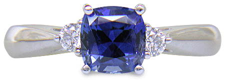 Square Cushion-cut Sapphire set with two round diamonds in a handcrafted platinum ring. (J8599)