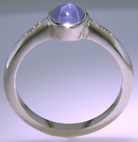 Side view of Star Sapphire and diamond platinum ring. (J7414)