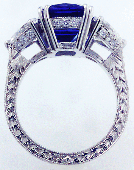 Platinum engraved ring with tanzanite and heart-shape diamonds.