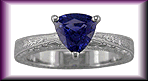 Trillium sapphire and platinum engraved ring.