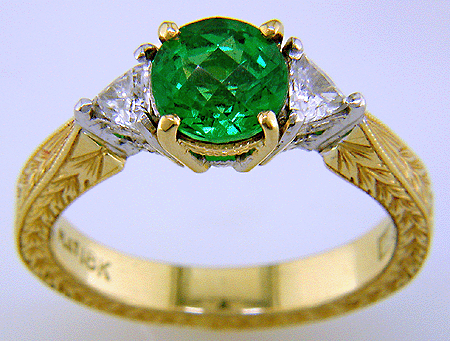 18kt gold ring with tsavorite garnet and diamonds.