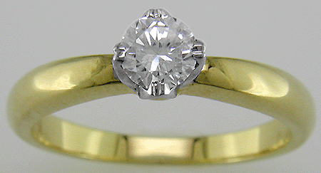 Solitaire diamond tulip set in an 18kt gold engagement ring with. (J2870)