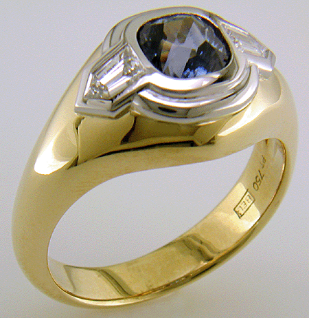 Custom Sapphire and Diamond ring crafted in 18kt gold and platinum.