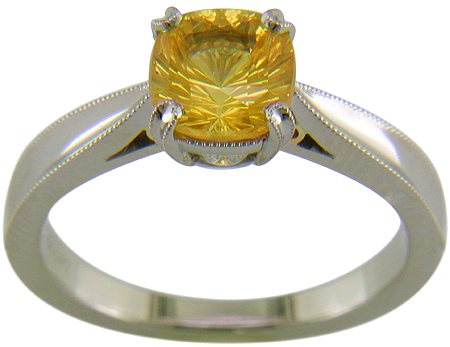 Concave faceted yellow sapphire set with two hidden diamonds in a handcrafted platinum ring. (J7253)