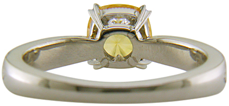 Inside view of concave faceted yellow sapphire set with two hidden diamonds in a handcrafted platinum ring. (J7253)