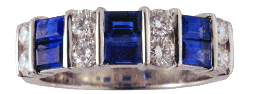 Platinum wedding band with sapphire baguettes and round diamonds.