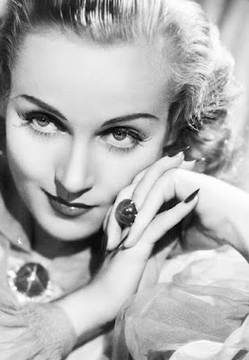 Carole Lombard with star sapphire ring and brooch.
