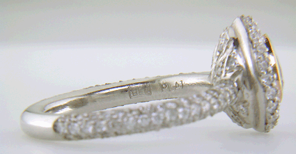 Close-up of Bijoux Extraordinaire hallmark (BEL) and platinum mark.