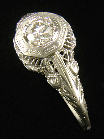 Antique filigree ring with diamond.