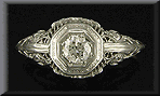 Antique filigree ring with diamond.