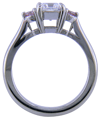 Side view of an Asscher-cut diamond set with two Fancy Pink diamonds in a handcrafted platinum ring.