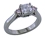 Asscher-cut diamond set with two Fancy Pink diamonds in a handcrafted platinum ring.