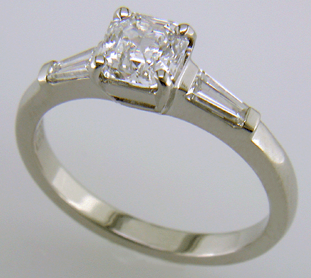 Asscher-cut diamond accented with tapered baguette diamonds set in a handcrafted platinum ring.