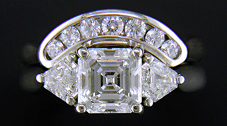 An Asscher-cut diamond ring with with contoured band.