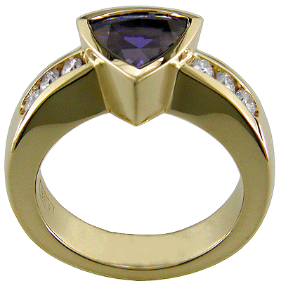 Side view of tanzanite and diamond ring crafted in 18kt gold.